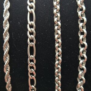 Set Of 4 Steel Stacking Bracelet Set.